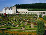 Chateau de Villandry vegetable garden, chateau and woods behindin the Loire Valley.