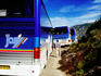 Tourist buses on road between Porto and Calvi.