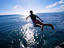 Boy jumping, ocean, Hawaii