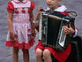 A pair of young children busking at Moscow Mall, ulitsa Arbat.