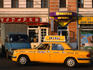 New yellow taxi in the street.