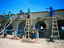 Workmen building a new school in a small village on the banks of the River Niger, near Mopti - Mopti