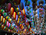 Strings of colourful paper lanterns suspended outside temple.