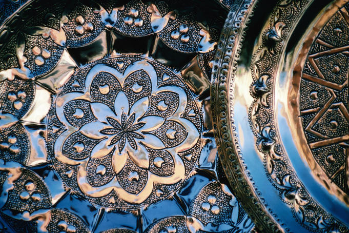 Copper trays with beaten designs.
