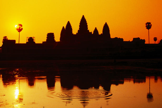 Sunrise over temple and sacred pond, Angkor Wat.