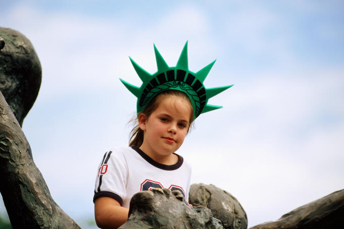 Portrait of girl with Statue of Liberty crown.