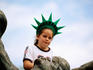 Portrait of girl with Statue of Liberty crown.