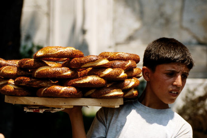 Boy selling pretzels.