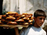 Boy selling pretzels.