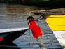 Girl playing with a boat.