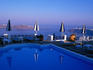 Hotel swimming pool overlooking caldera.