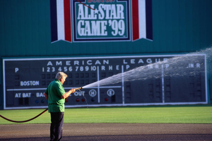 Groundskeeper tending Fenway Park in Boston.