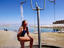 Woman showering at Dead Sea beach.