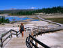Visitor to Porcelain Basin in Yellowstone's Norris Geyser Basin.