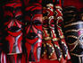Craft for sale: carved wooden masks at a souvenir stall at Bruma Market World
