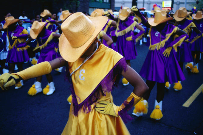 Marching girls participate in International District Parade.