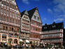 Medieval houses and outdoor tables of restaurants at Romer Area of Frankfurt.