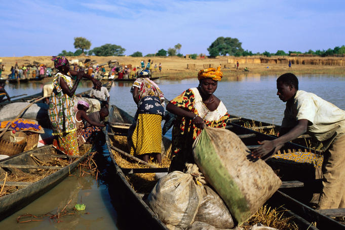 People unloading pirogues on the Bani River at Djenne's main northern entrance on Monday market day.