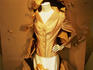 Woman's fashion clothing on display in shop window.