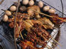 Vendors selling delicious Thai bbq chicken and eggs on the beach at Ko Samui.