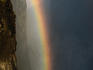 Rainbow over cliffs.