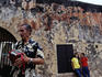 Man playing accordian at Castillo de San Christobel.