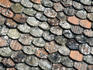 Ageing and variegated colurs of roof tiles of Chateau Chillon on Lake Geneva.