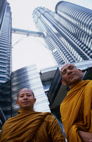Old world visits new: two visiting Thai monks at Petronas Towers