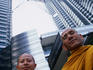 Old world visits new: two visiting Thai monks at Petronas Towers