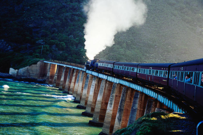 Outeniqua Choo-Tjoe steam train on bridge.