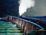 Outeniqua Choo-Tjoe steam train on bridge.