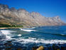 Beach with mountains in background.