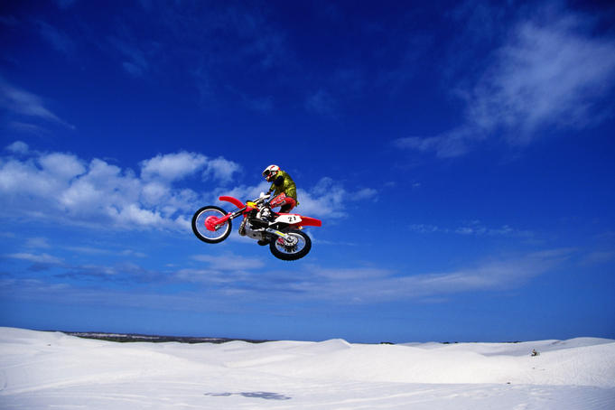 Motocross rider in mid-air.