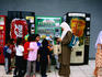 Children and women at drink machines, National Mosque.