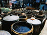 Buckets of soy sauce brewing.