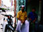 Men seated outside Indian Muslim restaurant, Campbell Street.