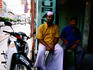 Men seated outside Indian Muslim restaurant, Campbell Street.