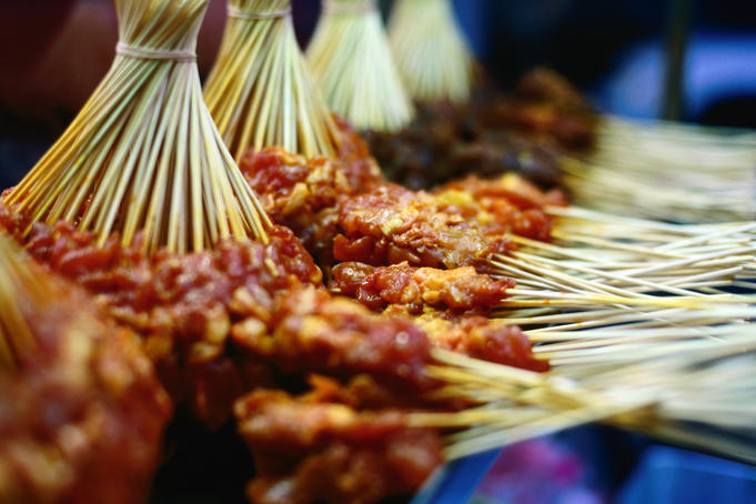 Uncooked satay at evening stall.