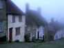 Street of 'Gold Hill' shrouded in fog.
