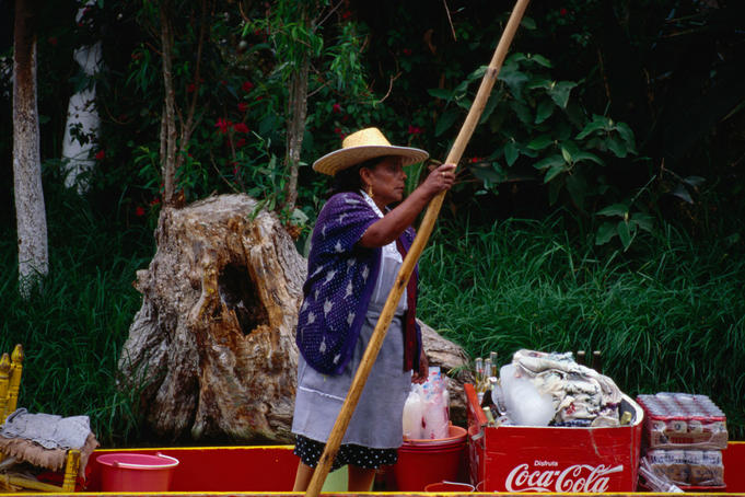 Families, friends, lovers, travellers and vendors crowd the waterways of the Floating Gardens of Xochimilco, Mexico City