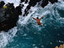 Clavadista (cliff diver) jumping into canal.