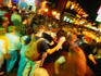 Night-time revellers on Bourbon Street in the New Orleans French Quarter.