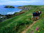 Ramblers on the Pembrokeshire Coastal Trail above the Marloes Sands Cliffs.