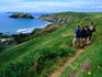 Ramblers on the Pembrokeshire Coastal Trail above the Marloes Sands Cliffs.