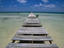 Wooden pier with broken planks.