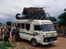 Heavily laden minibus.