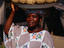 Woman with sea sponges, Côte d’Ivoire