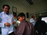 Young boy gets a haircut in Quito.