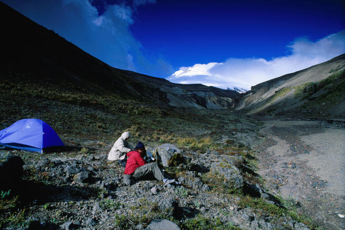 Backpackers cooking on the south side of Cotopaxi Volcano.