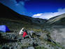 Backpackers cooking on the south side of Cotopaxi Volcano.